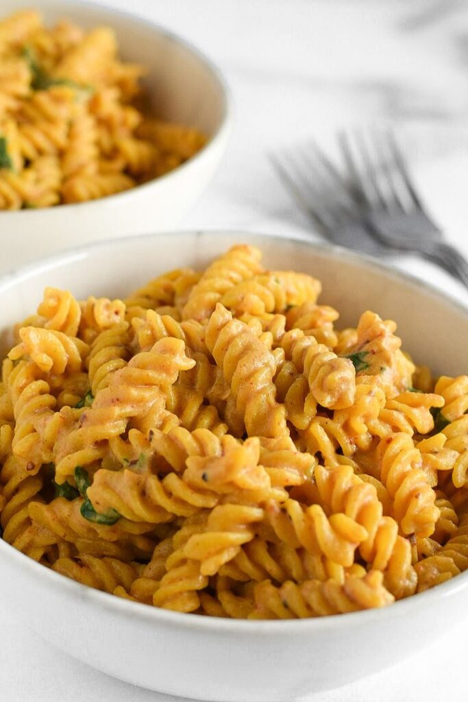 This easy vegan mac and cheese recipe comes together in just 20 minutes. Gluten, dairy, and nut-free, this healthy version of the classic comfort food is sure to hit the spot!