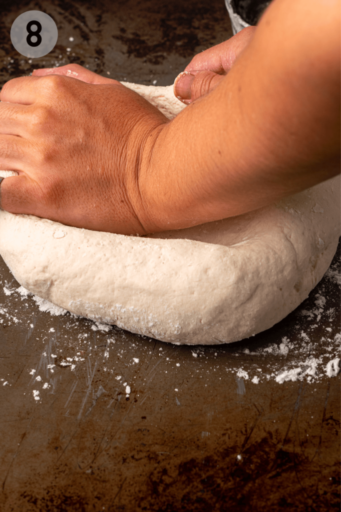 hands kneading gluten free focaccia dough