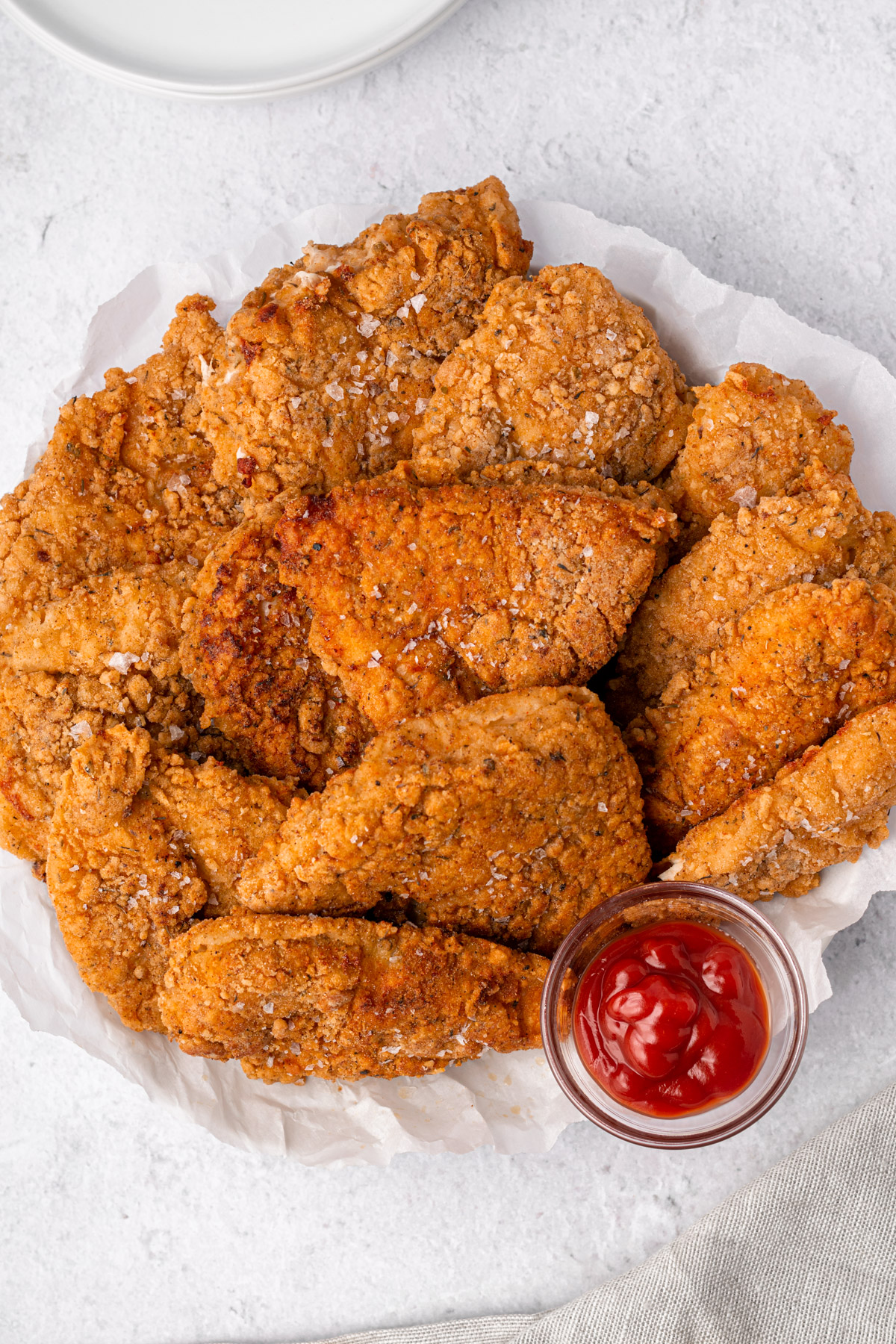 top view of gluten free fried chicken pieces on a plate