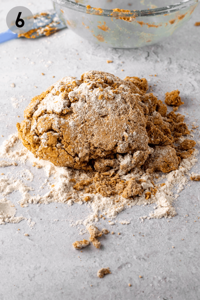 pumpkin scone dough on a floured surface