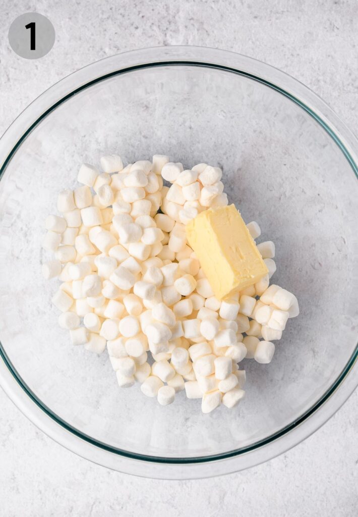 butter and marshmallows in a glass bowl