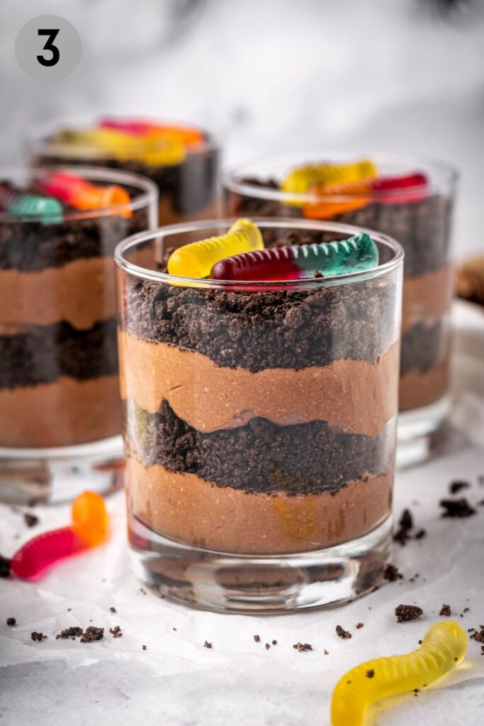 layers of pudding and cookie crumbs in a healthy dirt cup