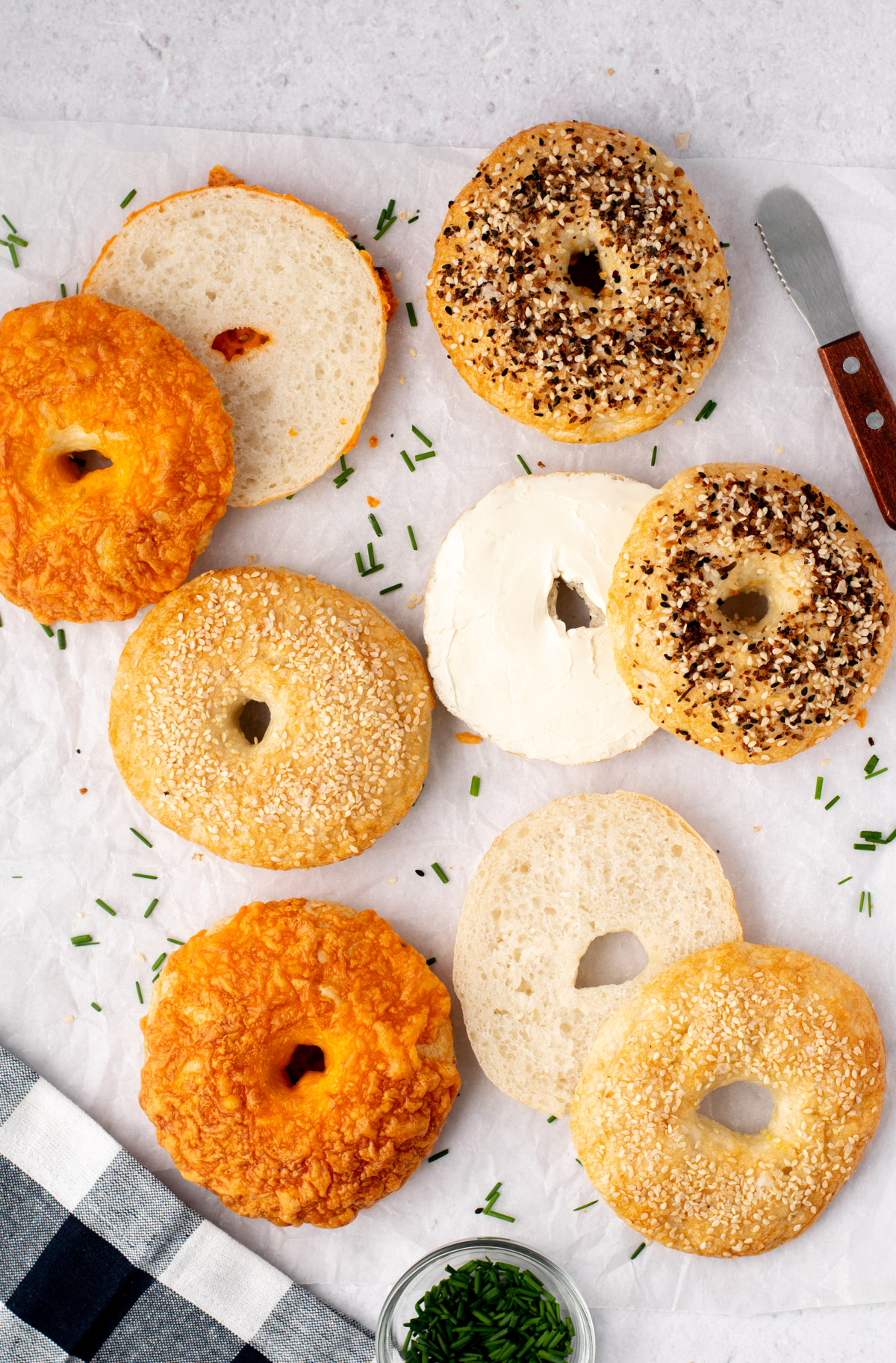 sliced bagels with chives sprinkled around