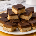 a pile of gluten free millionaire shortbread on a plate