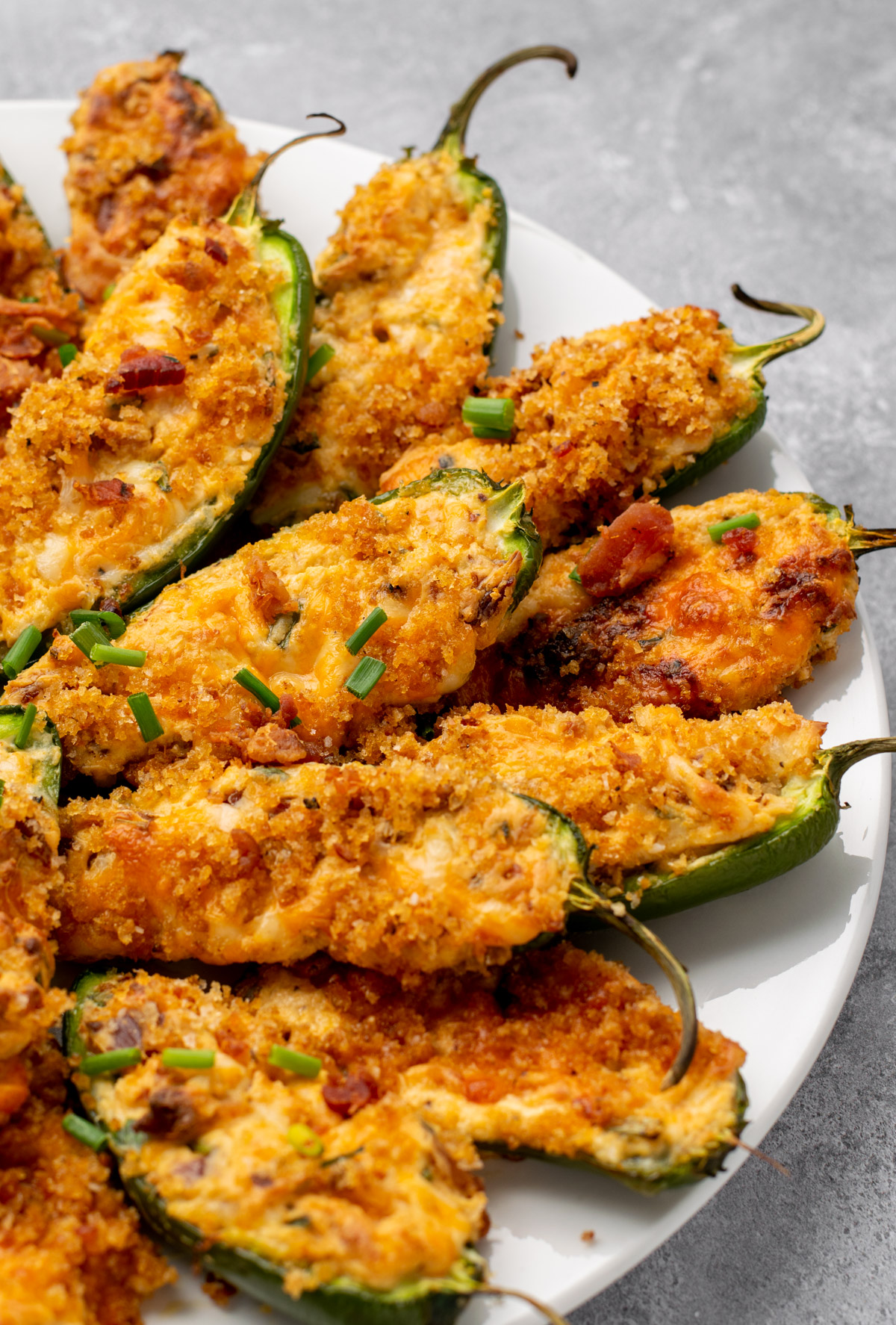 side view of jalapeño poppers on a plate