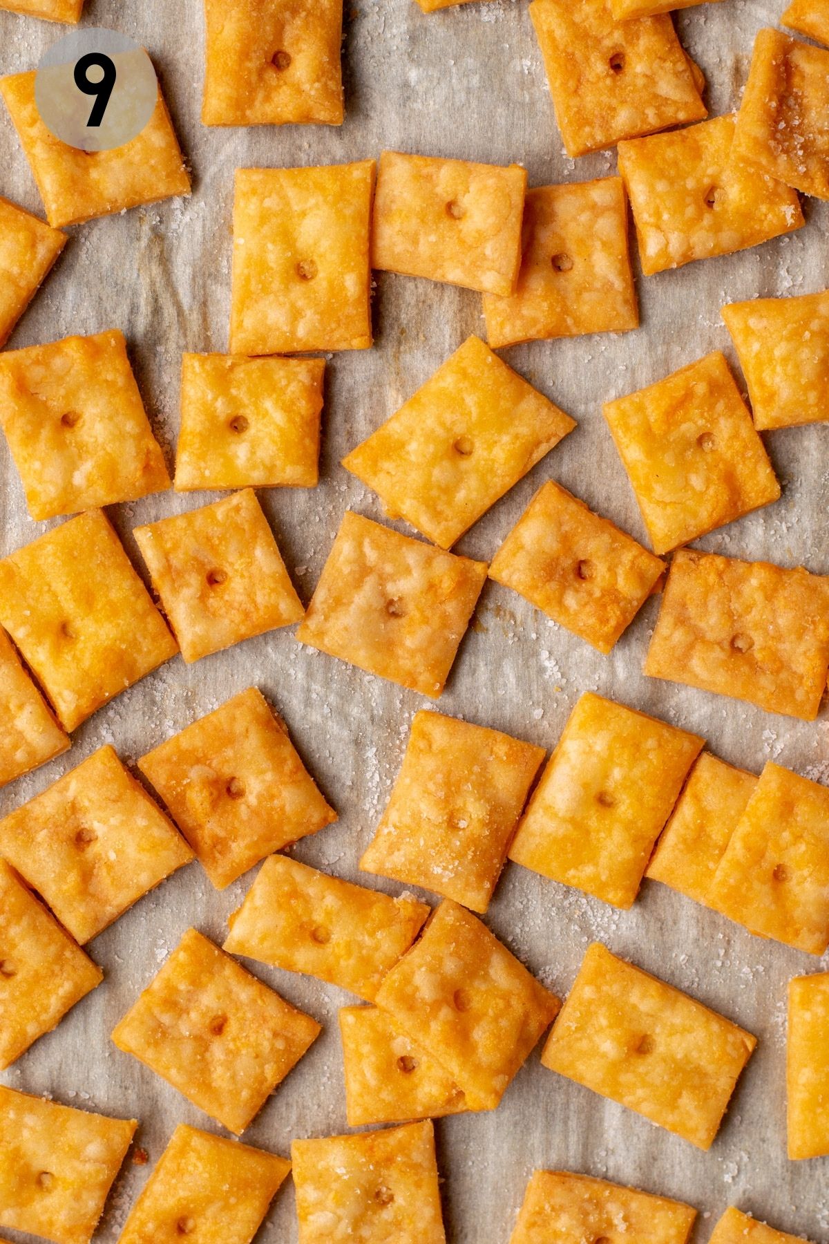baked cheez its on a parchment lined baking sheet