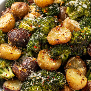 roasted broccoli and potatoes with parmesan and seasonings.