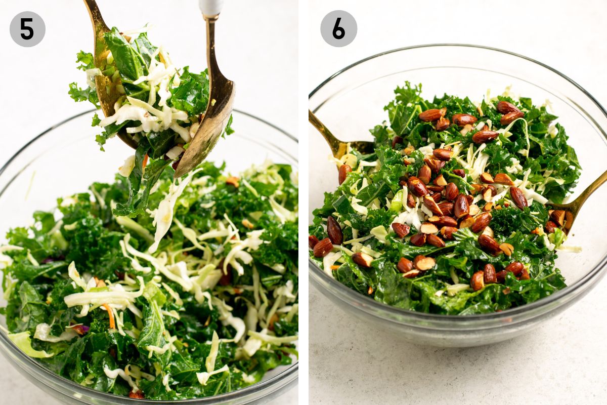 tossing a kale salad with gold salad spoons in a glass bowl.