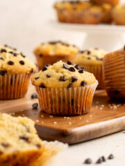 gluten free chocolate chip muffins on a wood board.