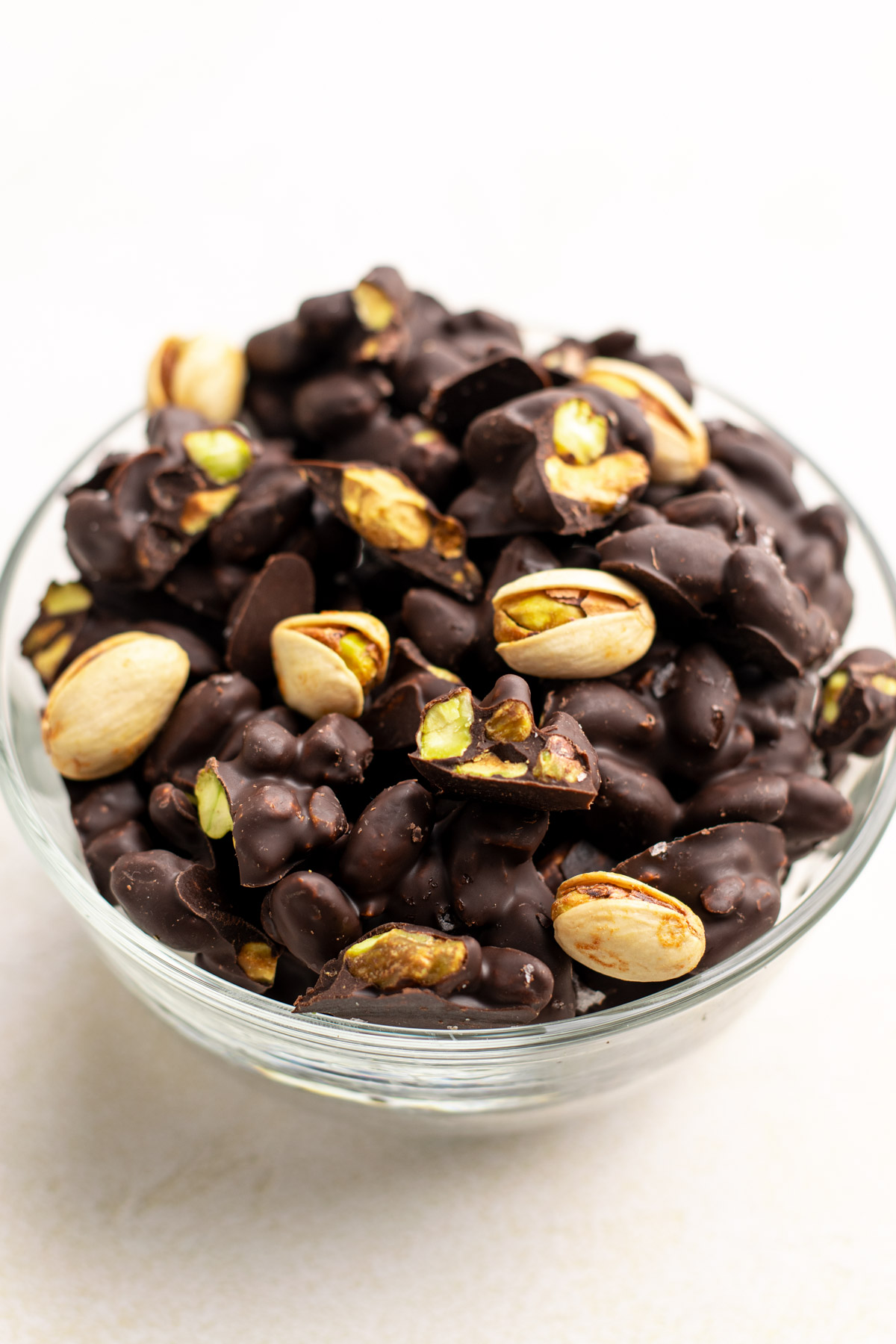 chocolate covered pistachios in a bowl.