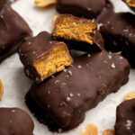 two halves of a butterfinger bar on top of other bars.