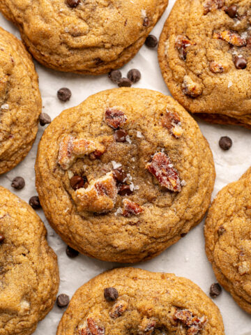 cookies with pecans and chocolate chips on a white background.