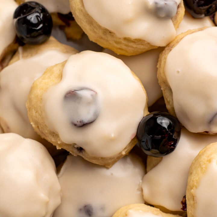 close up of ricotta cookies with amarena cherries.