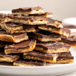 stack of christmas crack pieces on a plate.