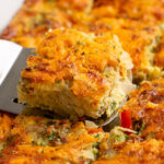 close up of a slice of hashbrown breakfast casserole.