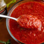 authnetic italian no cook pizza sauce with a spoon.