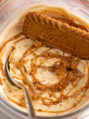 biscoff protein ice cream with a lotus cookie and a spoon.