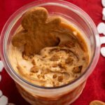 gingerbread protein ice cream with a gingerbread man cookie on top.