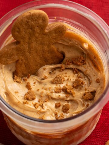 gingerbread protein ice cream with a gingerbread man cookie on top.