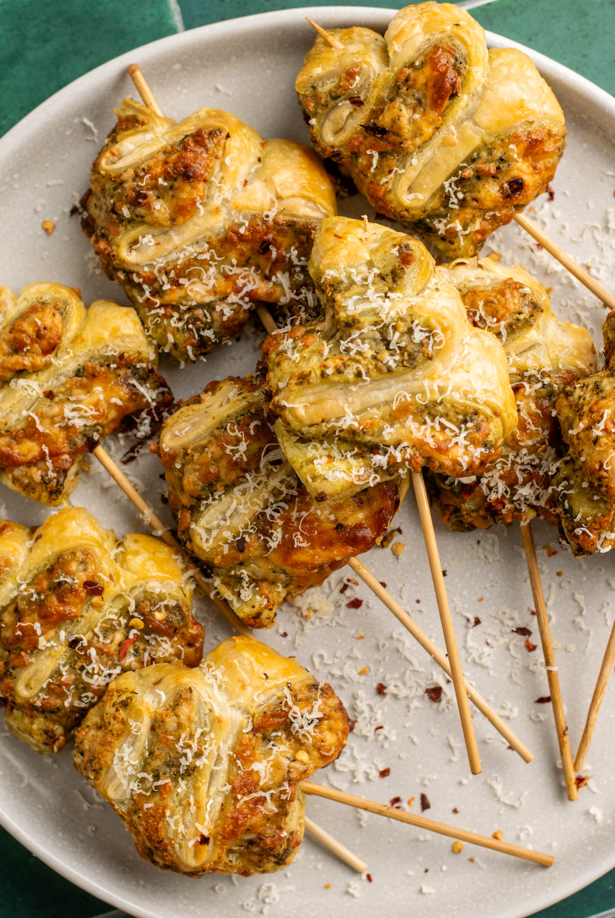 pesto puff pastry tree skewers on a plate.