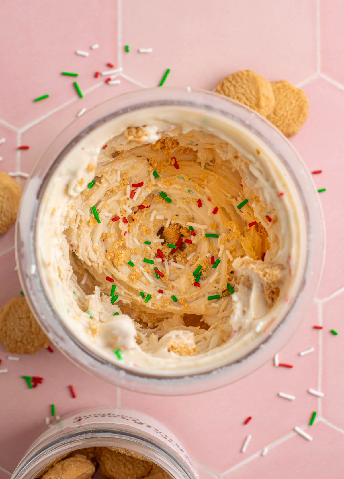 top view of a pint of sugar cookie protein ice cream with sprinkles and cookie pieces.