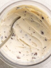 pint of protein stracciatella ice cream with a spoon.
