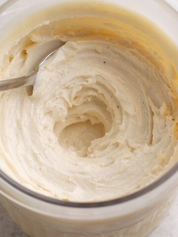 vanilla protein ice cream in a ninja creami tub.