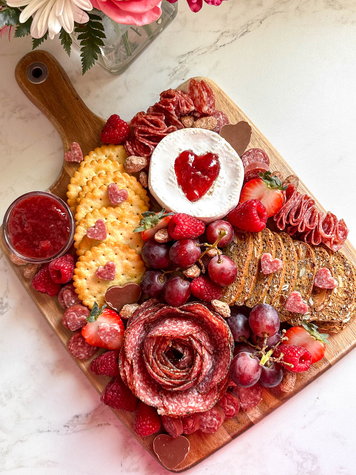 pink and red valentines charcuterie board.